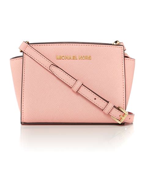 mk pink crossbody bags.